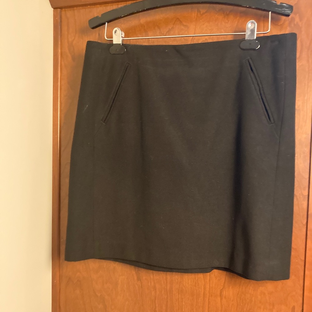 Flattering above-the-knee black skirt